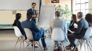 Employer reviewing new health coverage plan with employees.